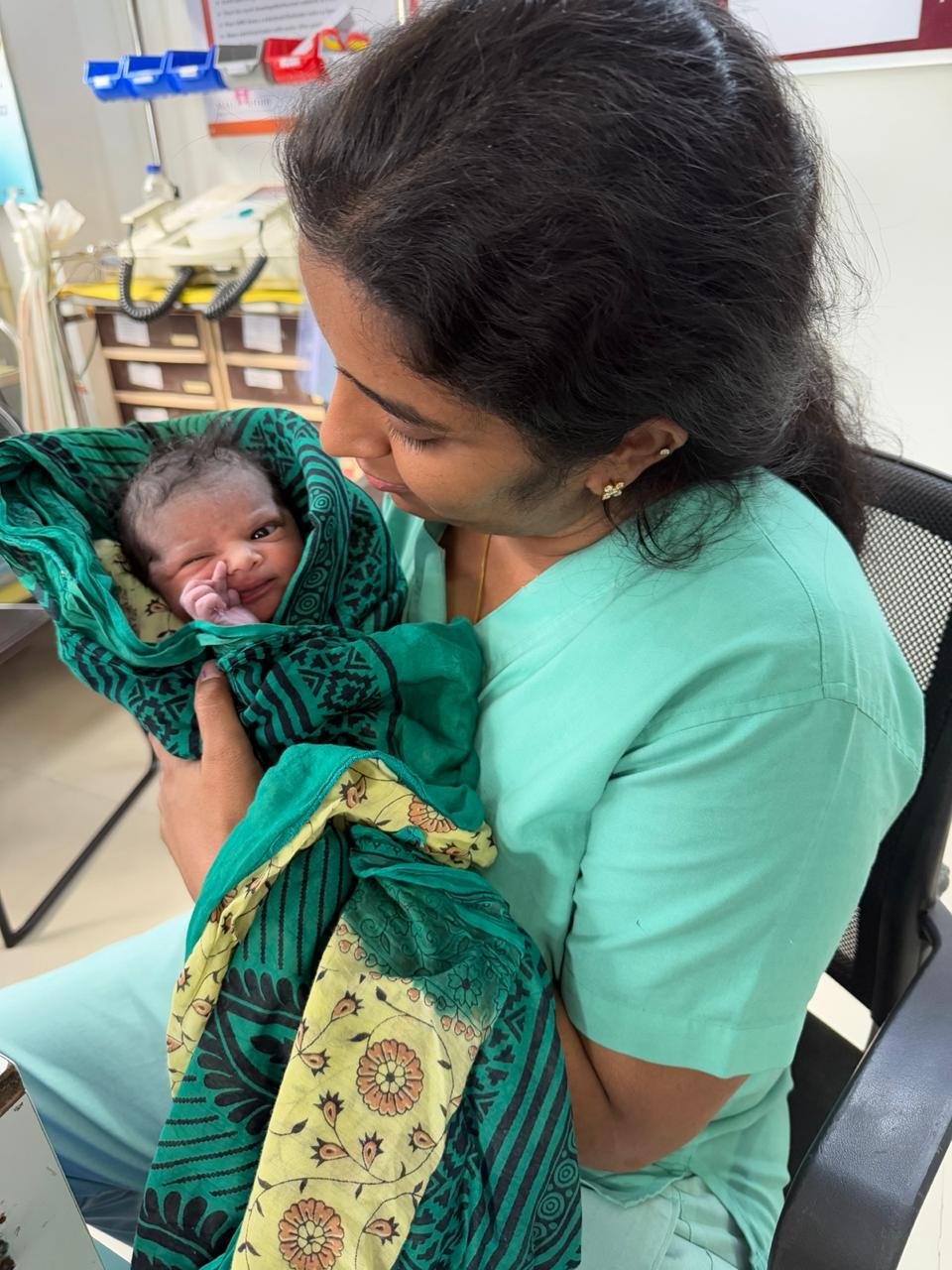 Dr. Meghana Reddy caring for a newborn baby